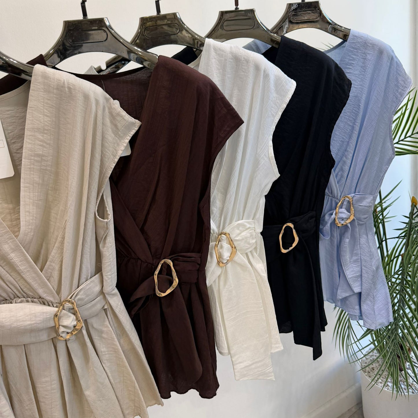 Wrap tops with gold buckle detail